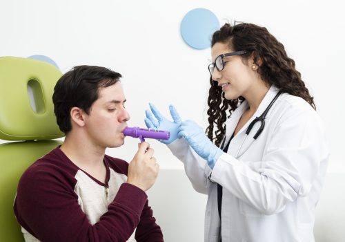 side-view-patient-using-peak-flow-meter side-view-patient-using-peak-flow-meter